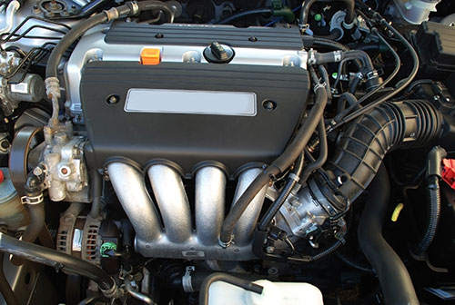 Engine showing belts and hoses that need to be maintained and serviced